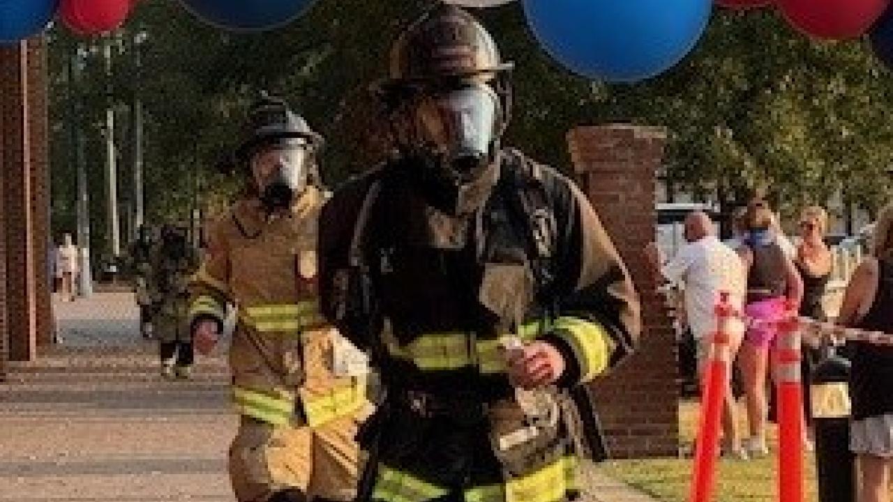 Firefighter shown in the Firefighter 5K race for CURE Childhood cancer.