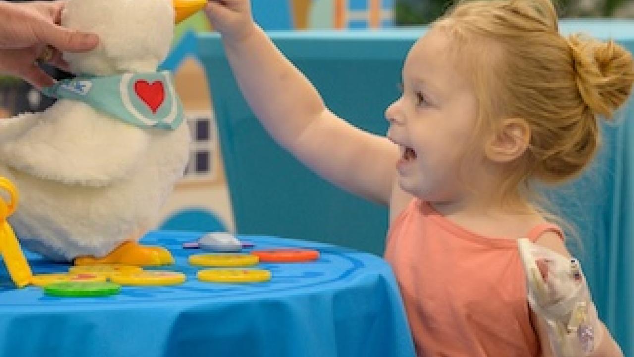 Young patient shown with an Aflac My Special Duck.