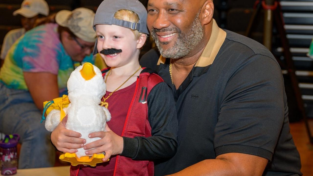 Young camper at Sunrise Day Camp shown with his Aflac My Special Duck.