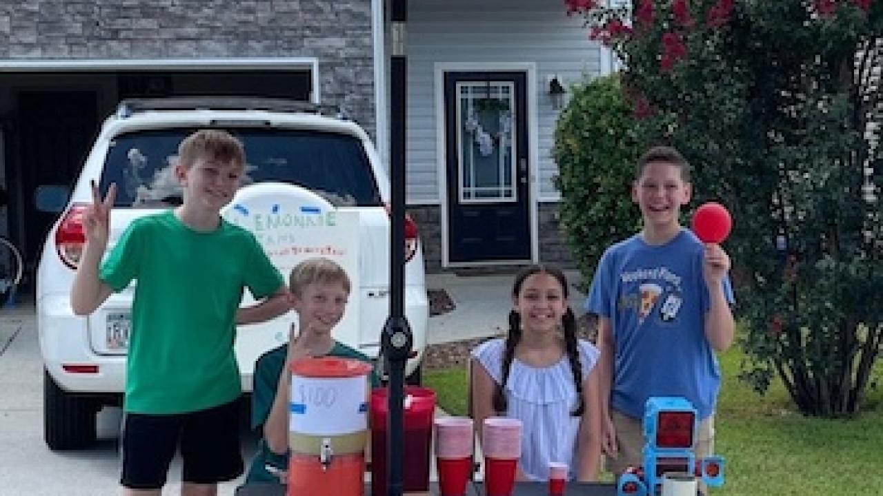 Rowan and his friends at his lemonade stand.