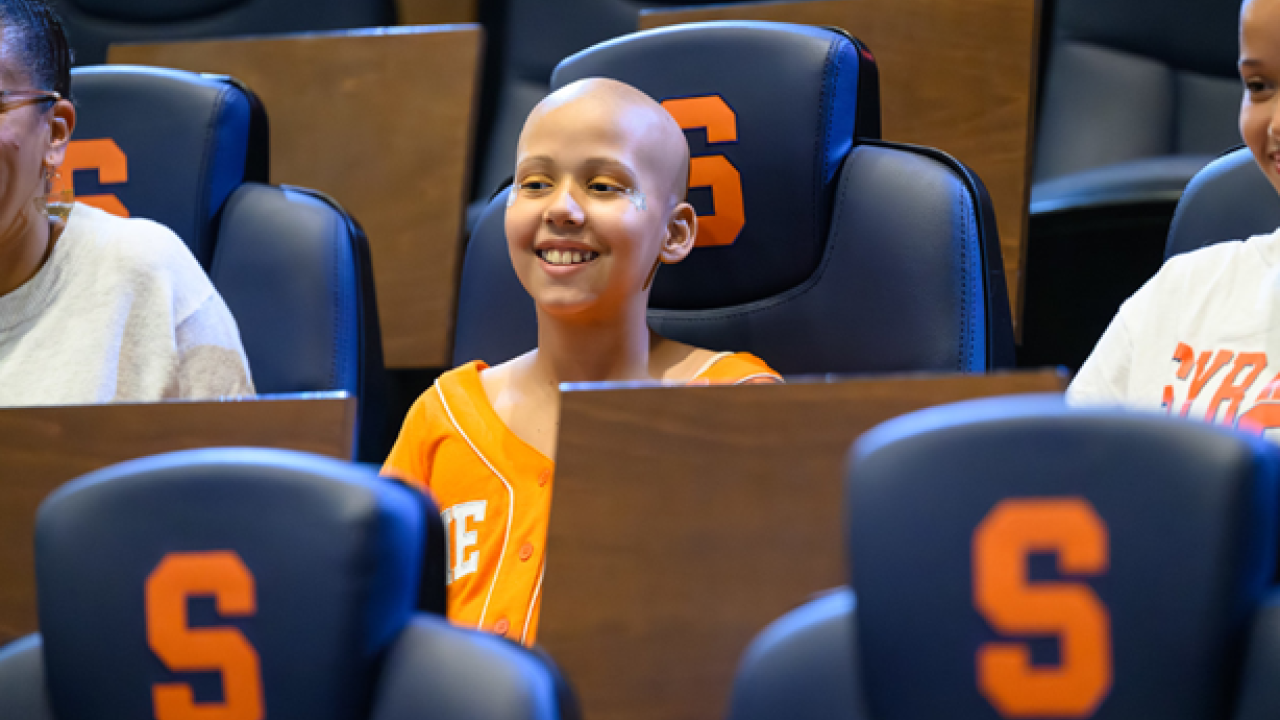 Judy shown seated at the Syracuse game.