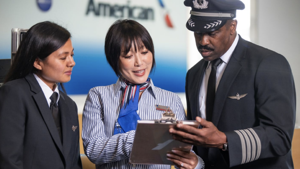 Airport staff looking at a clip board 