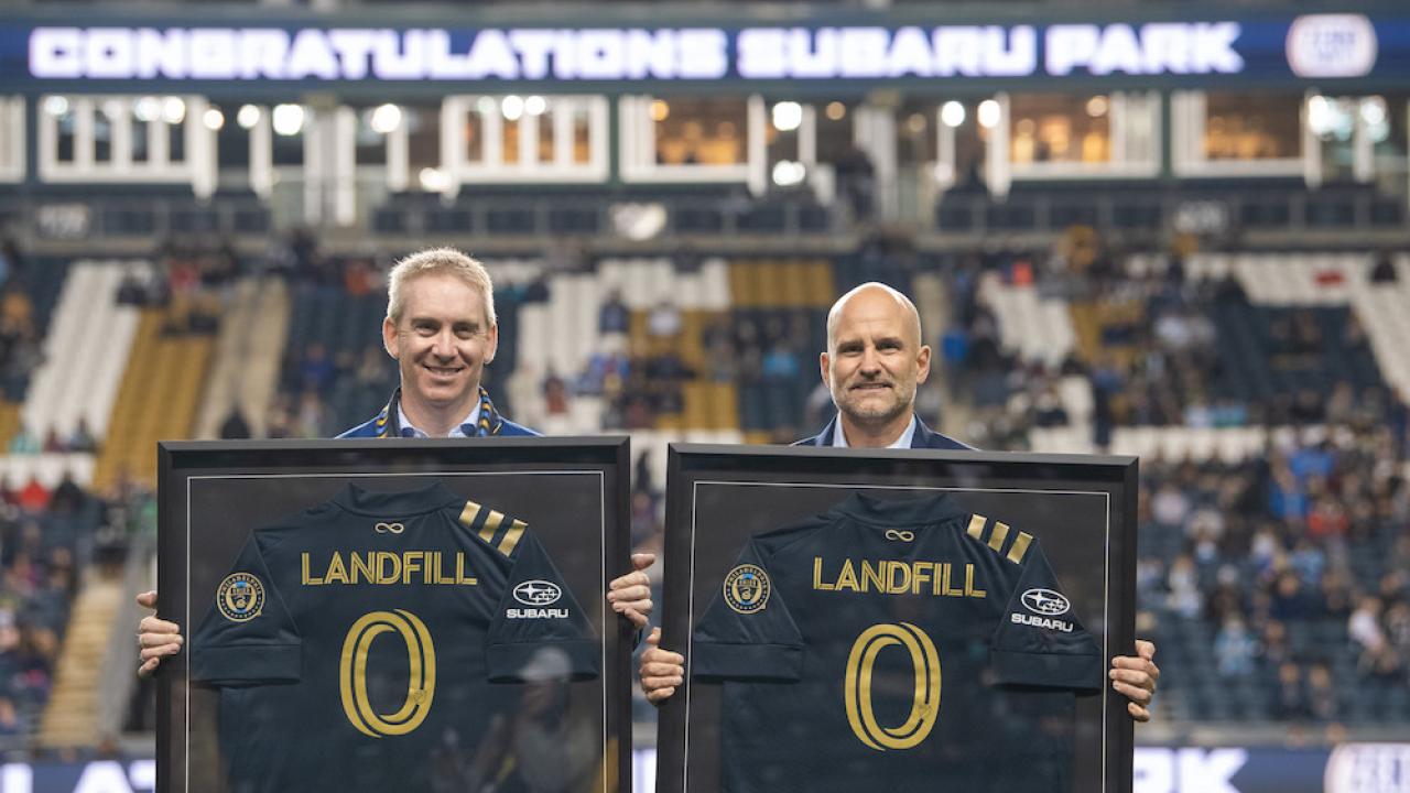 Alan Bethke, Subaru of America Inc.’s Senior Vice President - Marketing, and Tim McDermott Philadelphia Union’s President, celebrate Subaru Park becoming the first soccer stadium in Major League Soccer to achieve zero landfill status on October 23, 2021.  