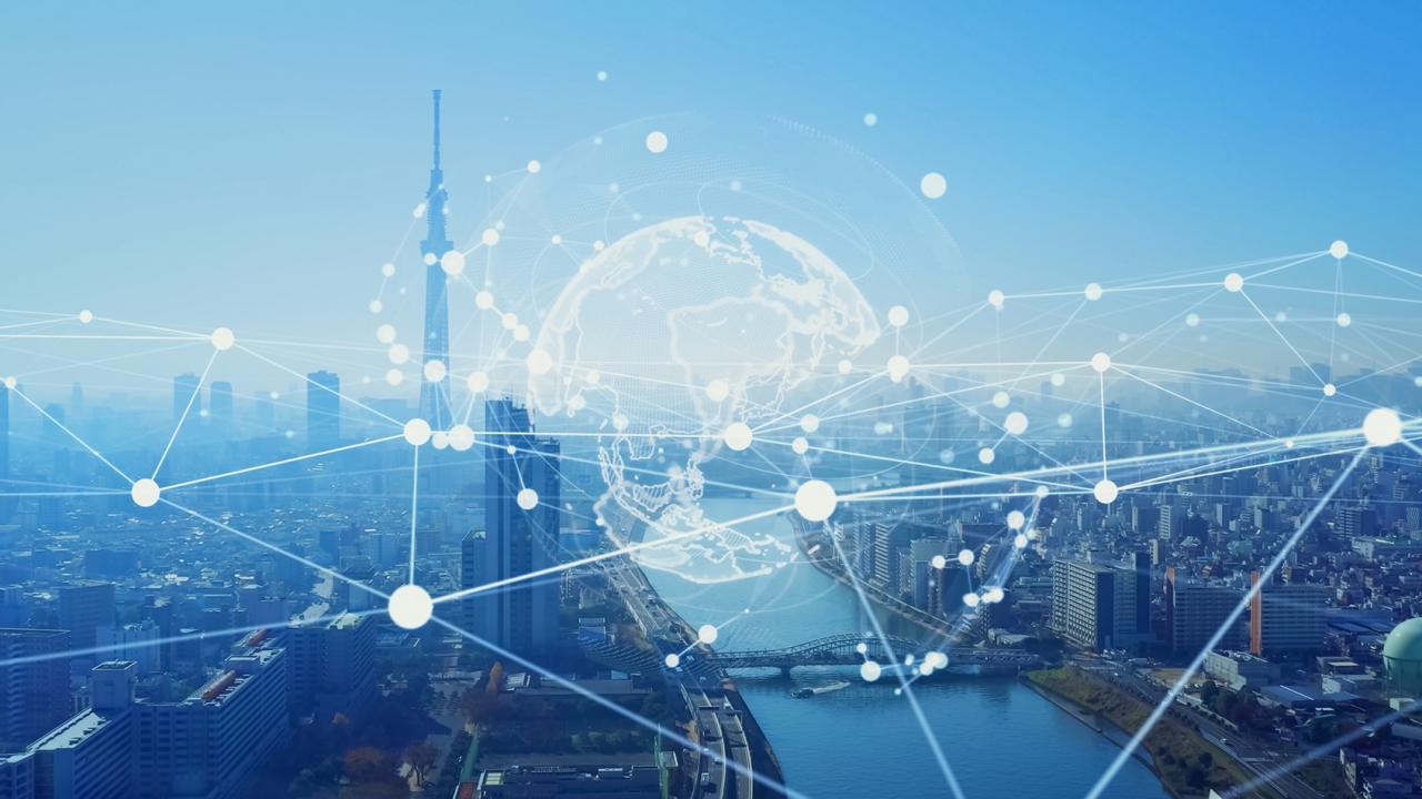 Transparent globe and web over a city skyline