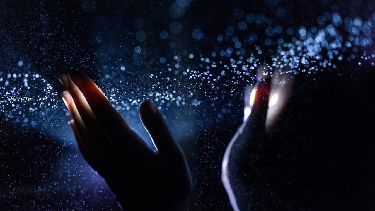Hands touching water