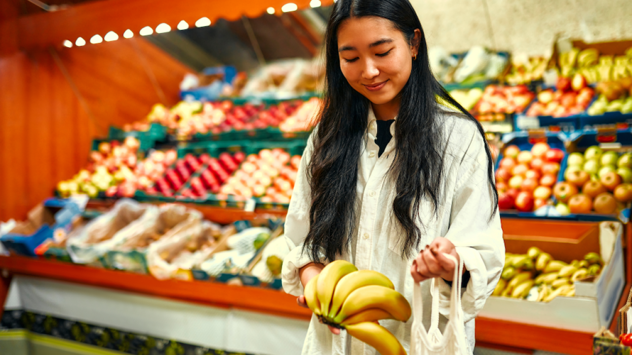 Asian woman shopping in the grocery store.