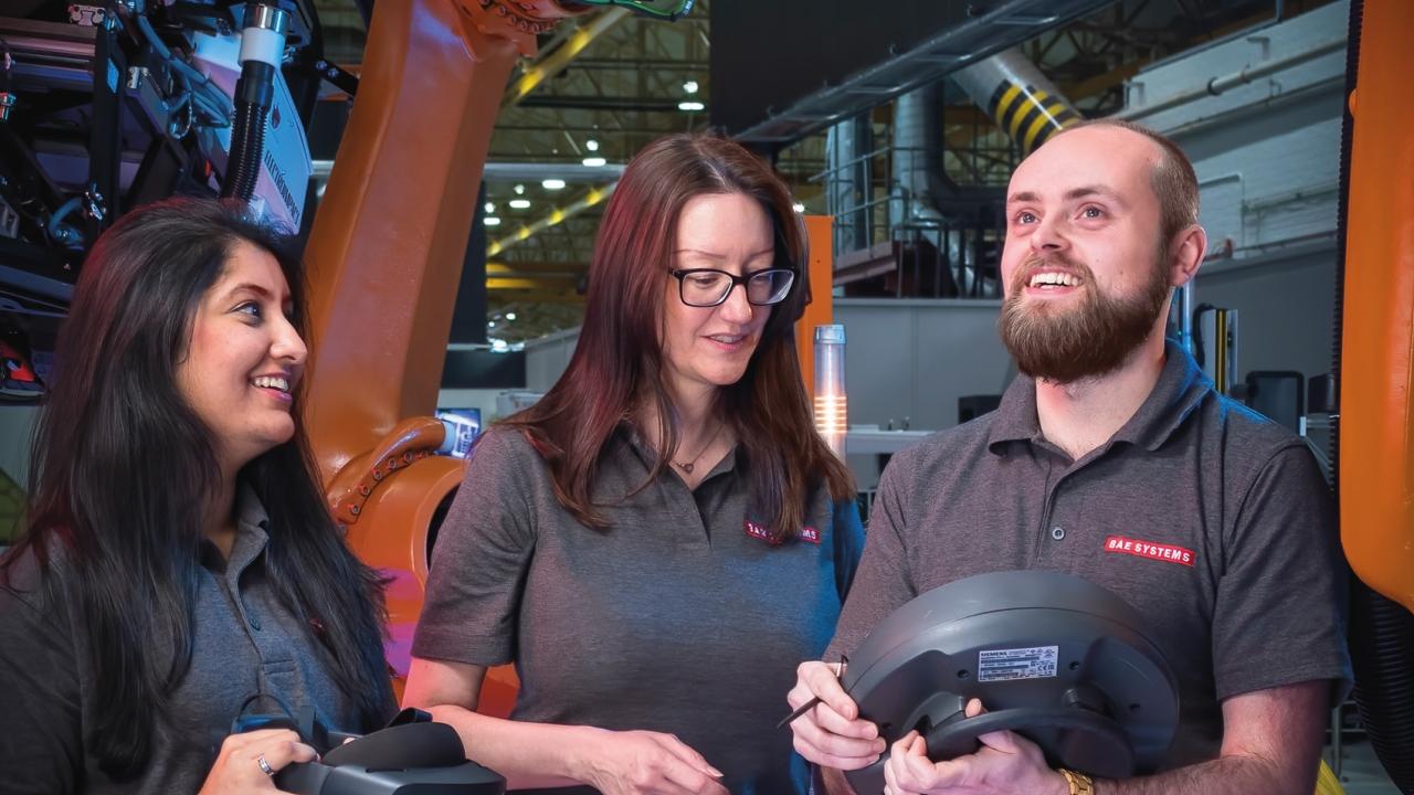 people working with the text "Annual Report 2021 BAE Systems plc"