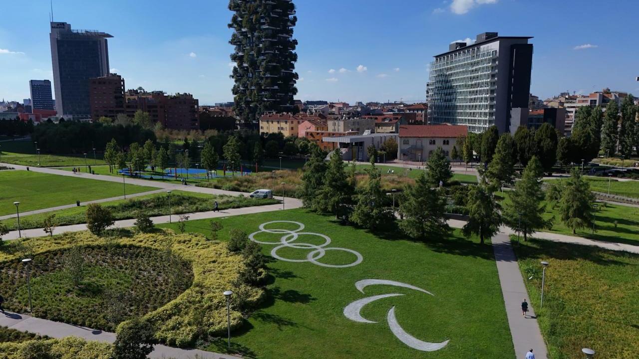 A performing land art installation featuring the Olympic rings and Paralympic Agitos