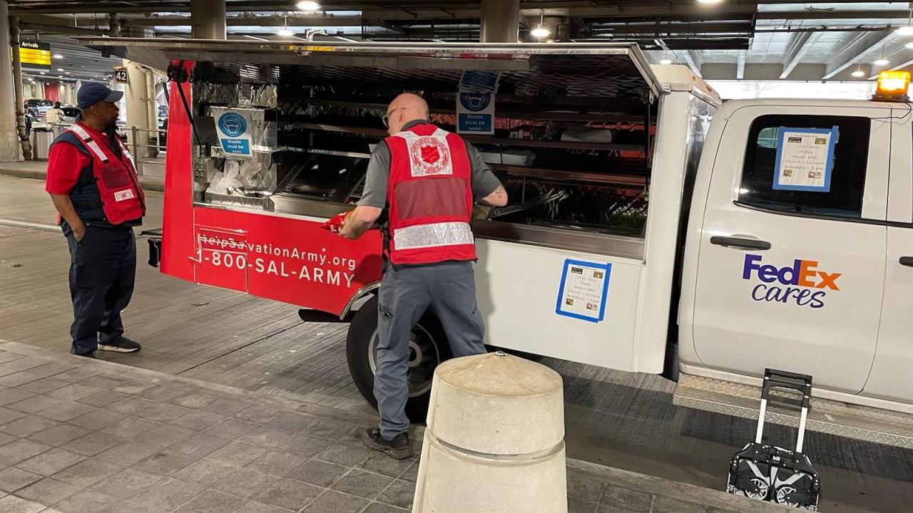 canteen truck workers in red safety vests