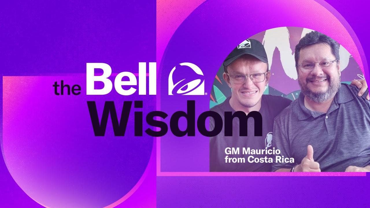 "The Bell Wisdom" Mauricio giving a thumbs-up next to an employee.