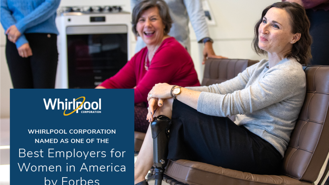Two smiling people seated on a brown couch, others in the background. Whirlpool logo and Best Employers for Women in America by Forbes.