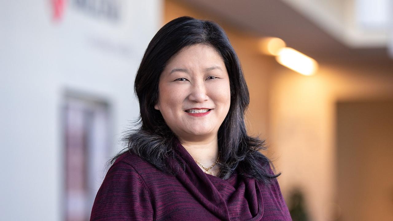 Betty Chiang in a purple sweater