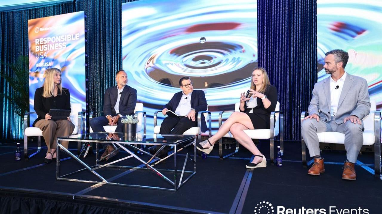 Panelists lead discussion on stage