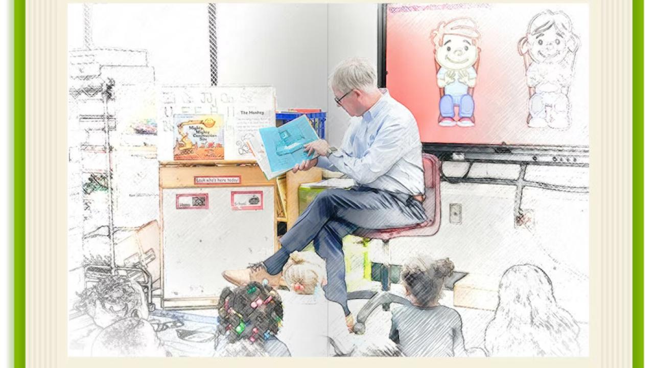 Bill Bateman reading to a classroom of children