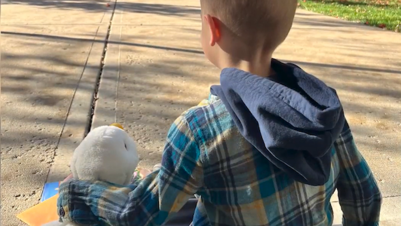 Young boy shown with My Special Aflac Duck.