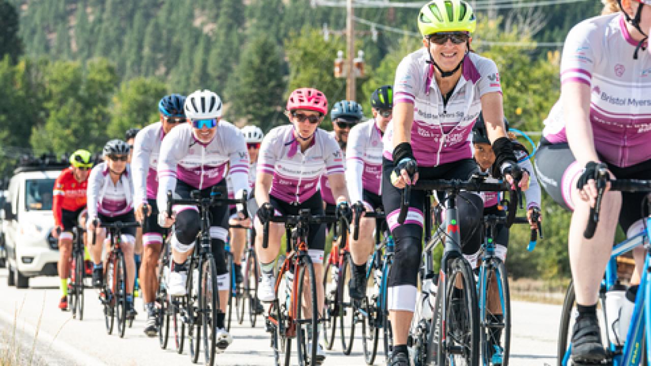 Cyclists ride in a line