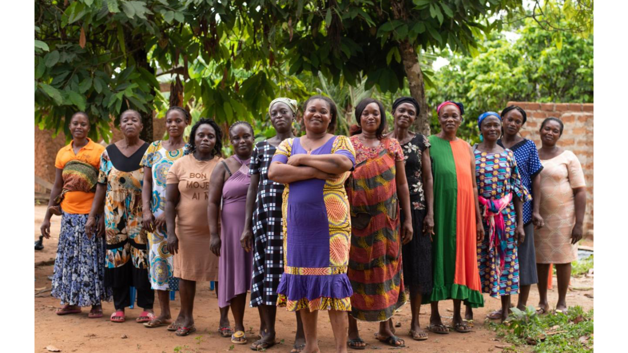 Group of women in a Ghanaian Village Savings and Loan Association stand together