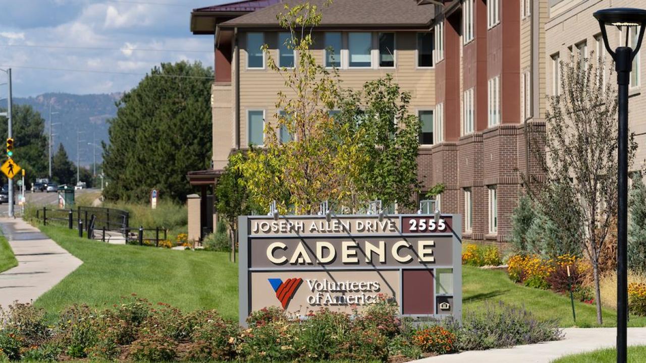 Cadence sign in front of building