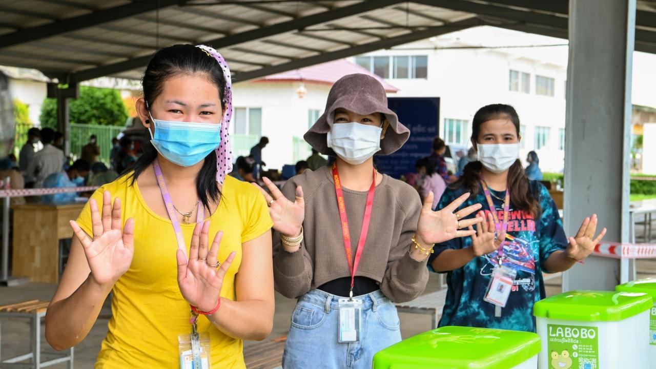 Factory workers at Sunbow factory, who are going to get their COVID-19 vaccines, wash their hands with Labobo, Kandal Stueng District in Kandal province, Cambodia, June, 2021.