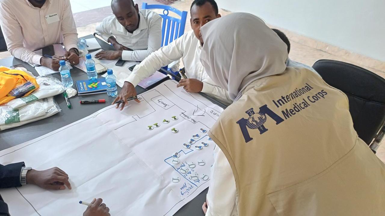 people working together on a chart