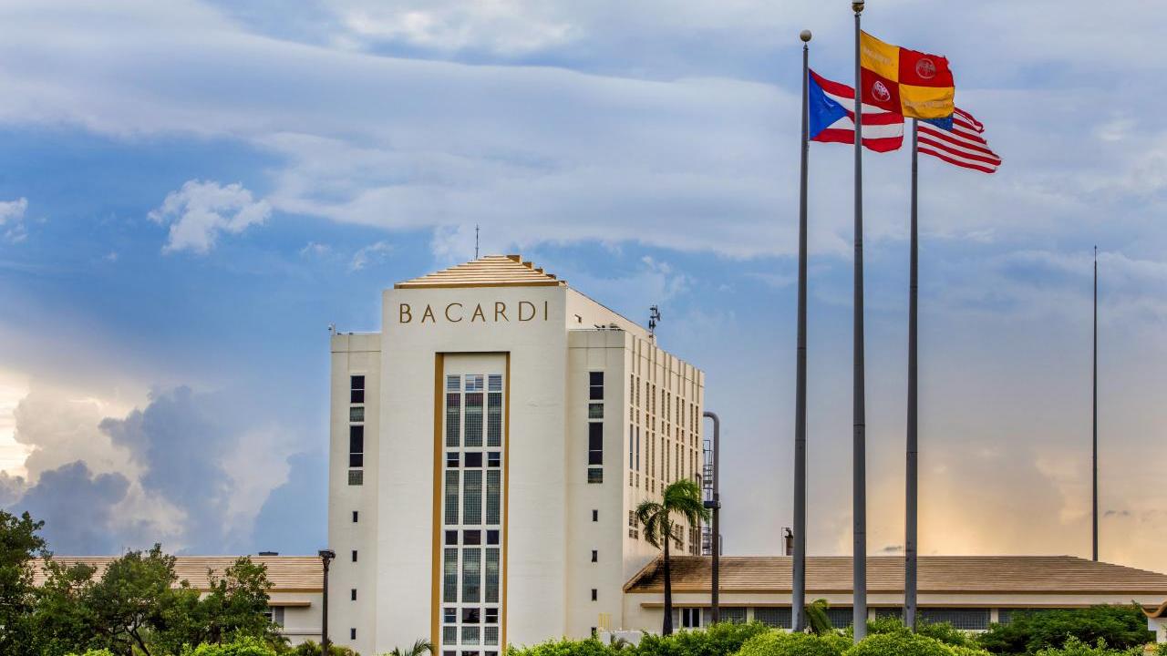 Exterior of the 'Cathedral of Rum' and three flag poles.