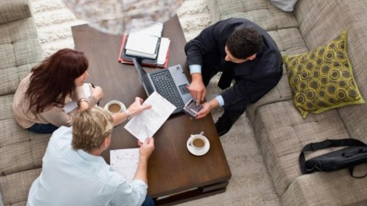 Aerial shot of three people working in office