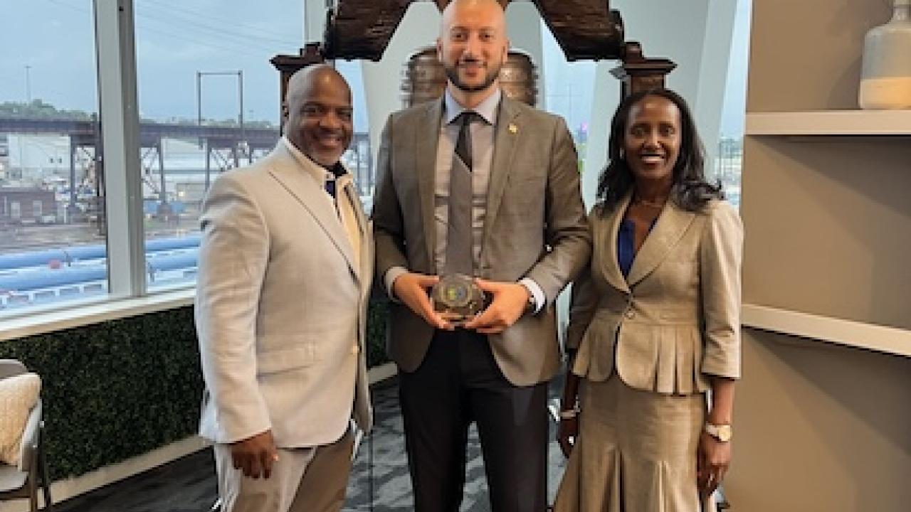 KeyBank representatives shown with members of Points of Light receiving an award.