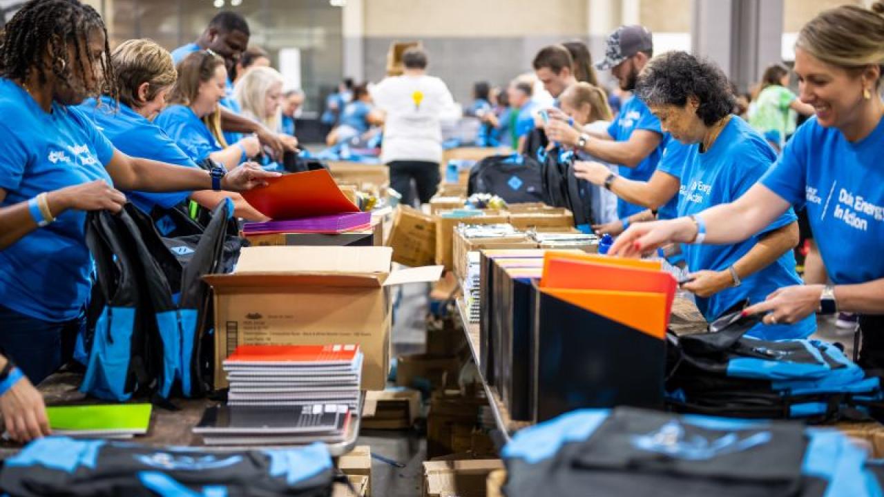 volunteers packing backpacks