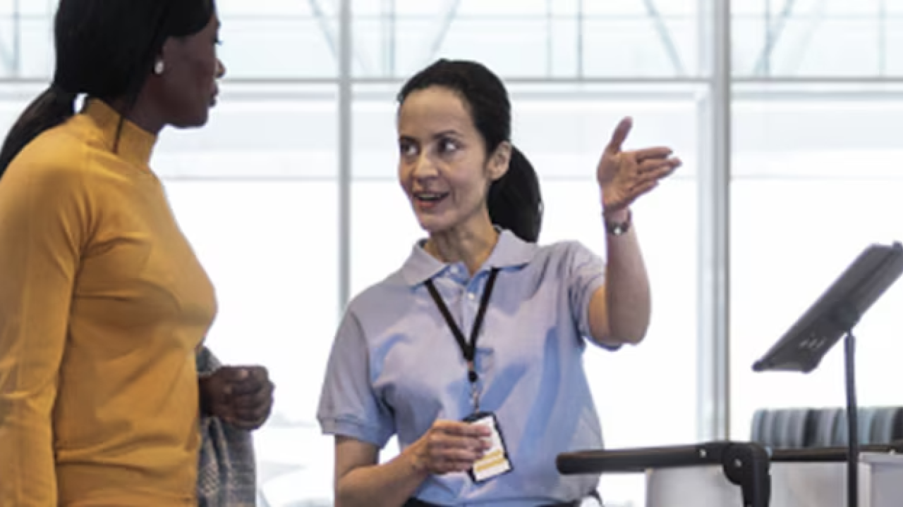 Two people shown having a discussion.