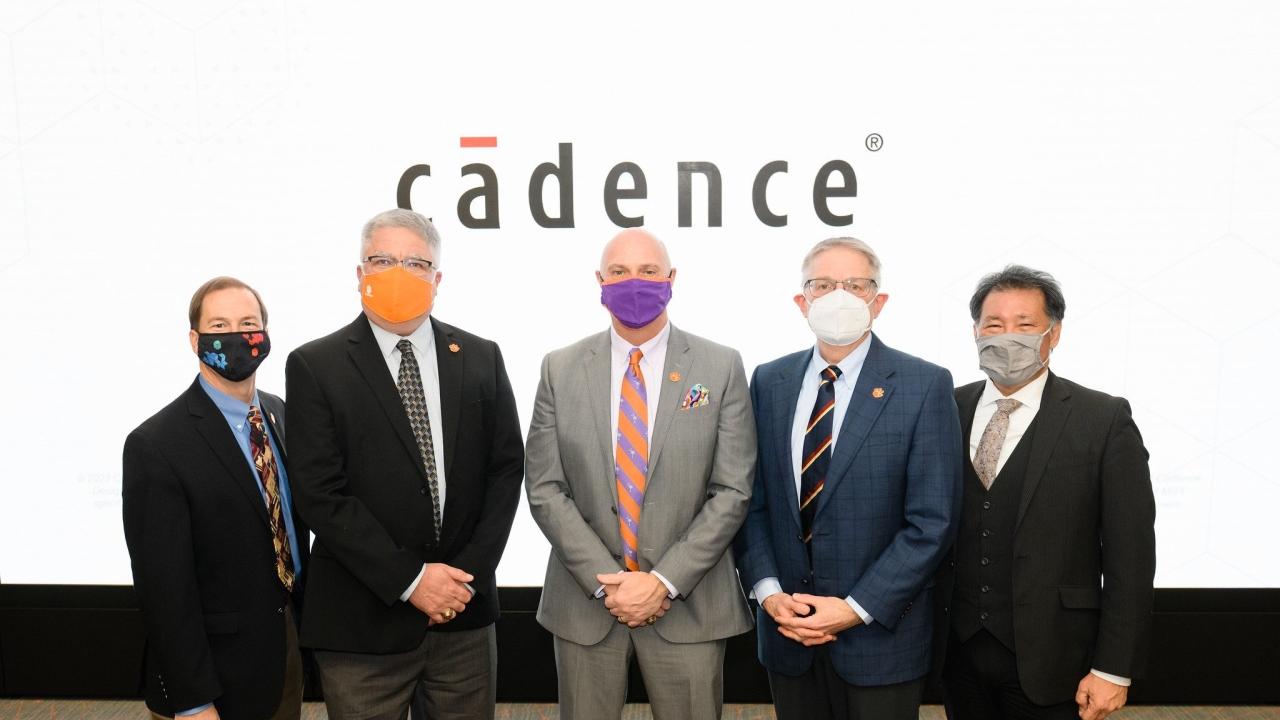5 people standing in front of the cadence logo