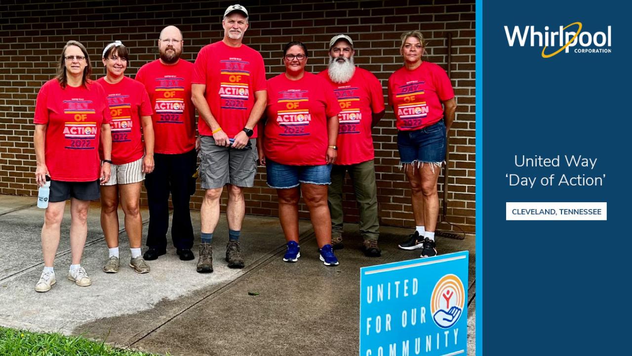 a group of seven people all wearing "day of action" t shirts. Whirlpool logo and United Way logo on the right