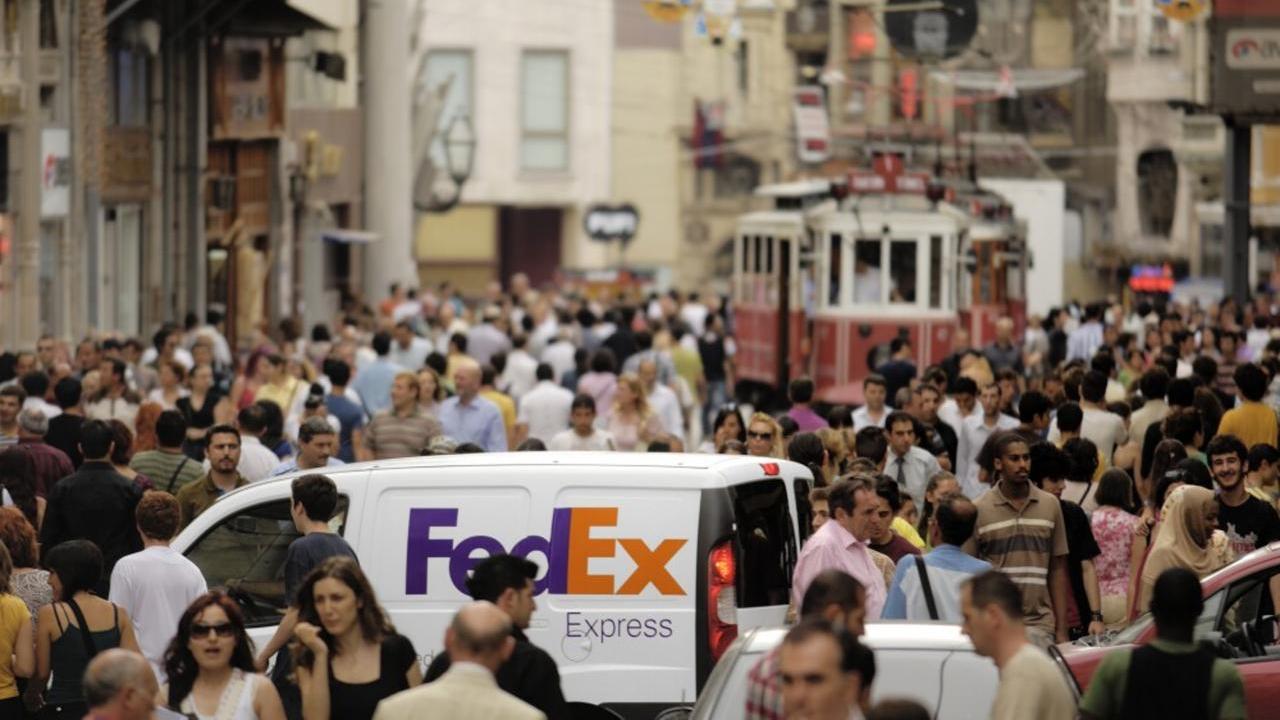 FedEx truck in busy streets