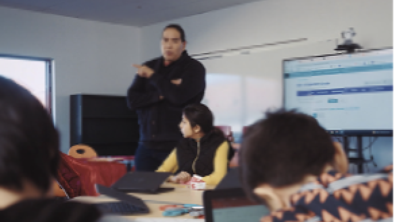 Teacher at the front of the classroom