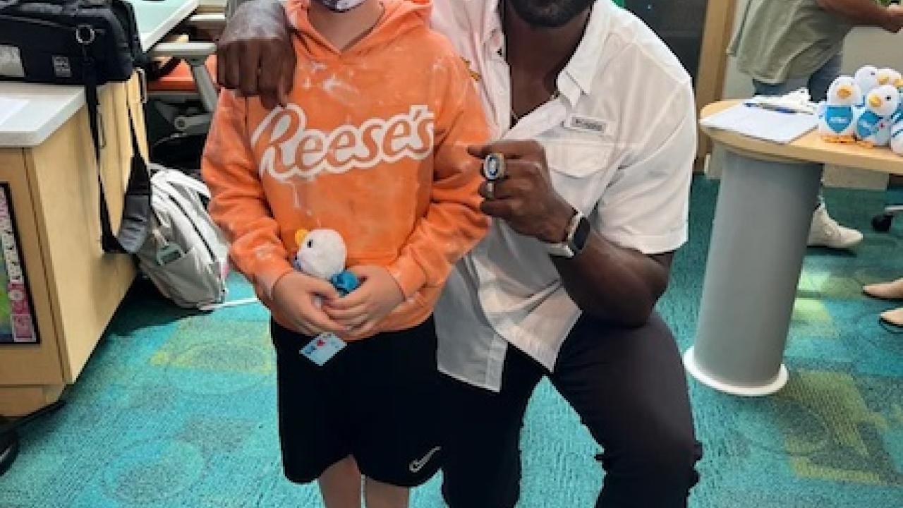 Colton Hall, 9, who was diagnosed with leukemia, gets a visit from former NFL star Calvin Johnson at Aflac Cancer and Blood Disorders Center in Atlanta Sept. 1. Courtesy The Hall Family