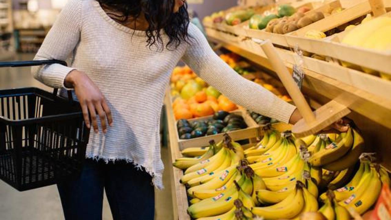 Woman shops for Fairtrade certified bananas