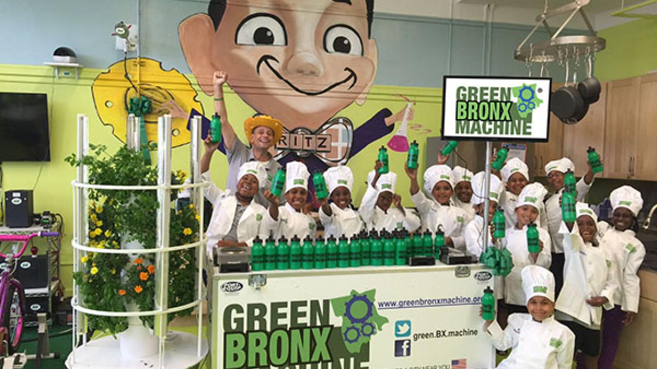 Green Bronx Machine with people surrounding it