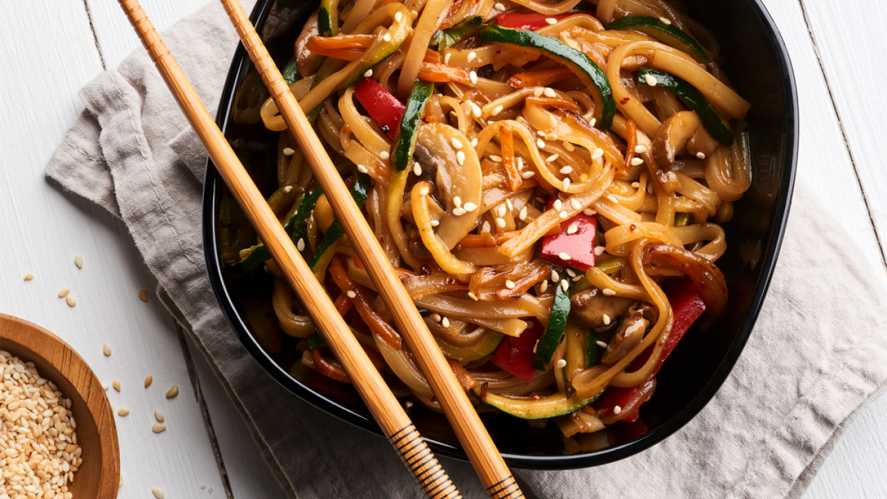 Bowl of noodles and chopsticks