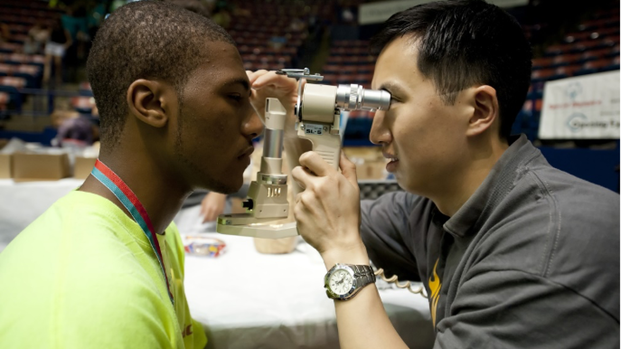 Man performing eye exam 
