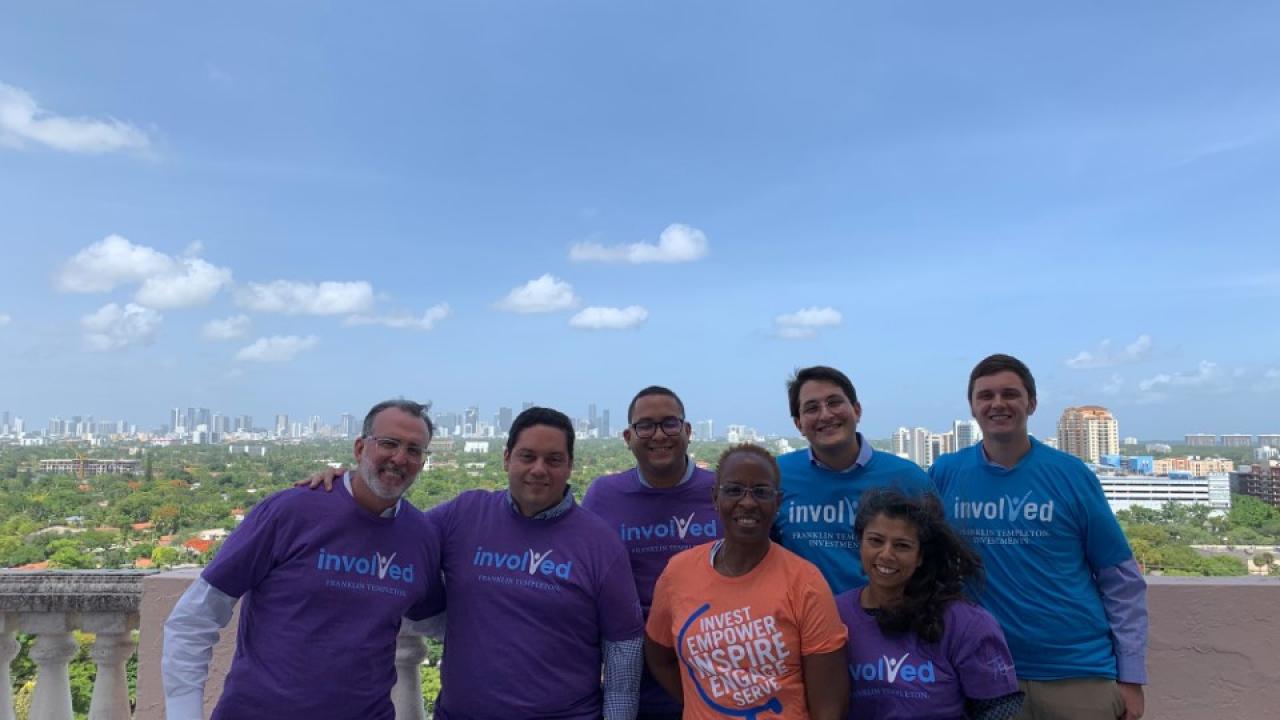 Group of employees wearing "Involved" T-shirts 