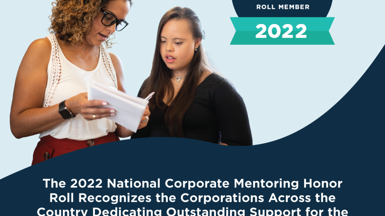 Picture of a mentor-mentee pair of professional women looking at a document with the words, "The 2022 National Corporate Mentoring Honor Roll Recognizes the Corporations Across the Country Dedicating Outstanding Support for the Youth Mentoring Movement" 