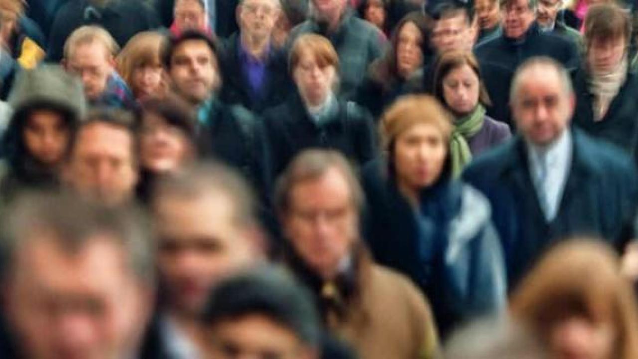 Large crowd of people walking 