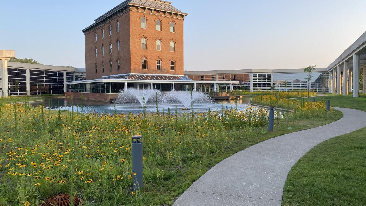 VoltStorage company headquarters with large building in the background and water fountain in the foreground