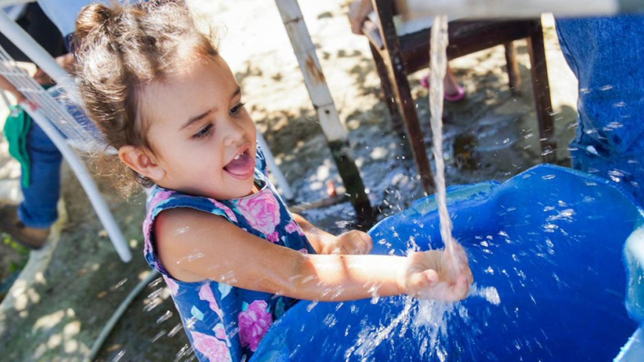 Child playing with water
