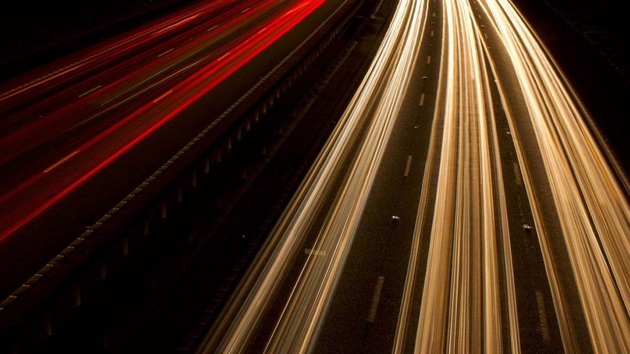 long exposure image of aerial shot of highway traffic 