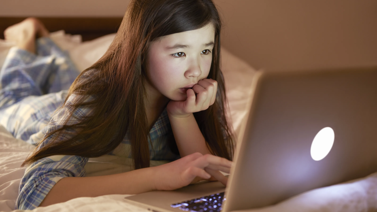 child looking at laptop computer screen