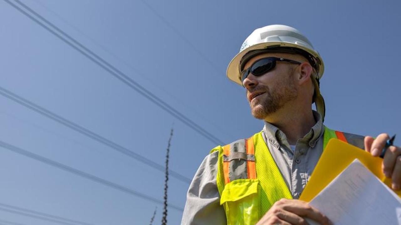 Will Ricks wearing a safety hat and hi-viz