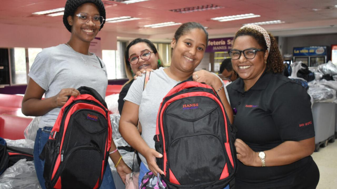 Students in the Dominican Republic shown with new backpacks provided by HanesBrands.
