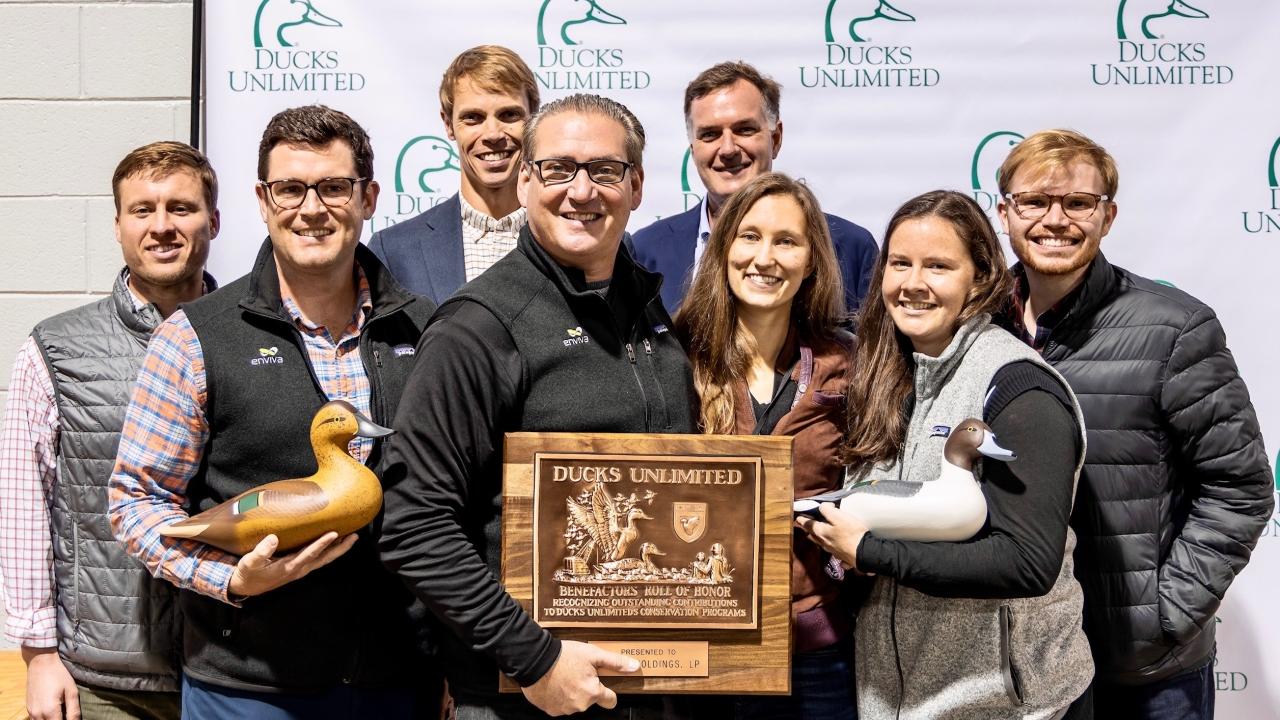 8 people from the Enviva team proudly accepts Ducks Unlimited award 