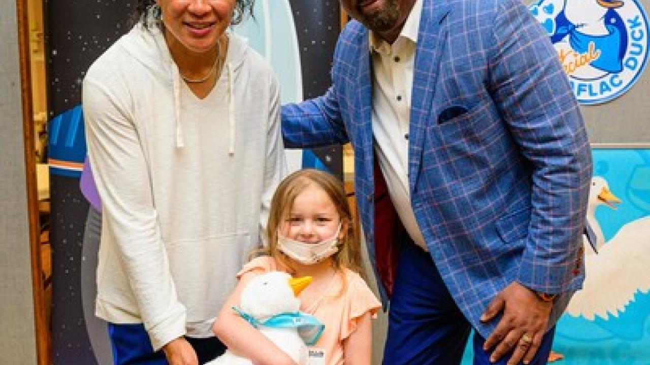 South Carolina women’s basketball head coach Dawn Staley and Aflac U.S. President Virgil Miller deliver My Special Aflac Duck to cancer and sickle cell disease patients at UVA Children's in Charlottesville, Virginia.