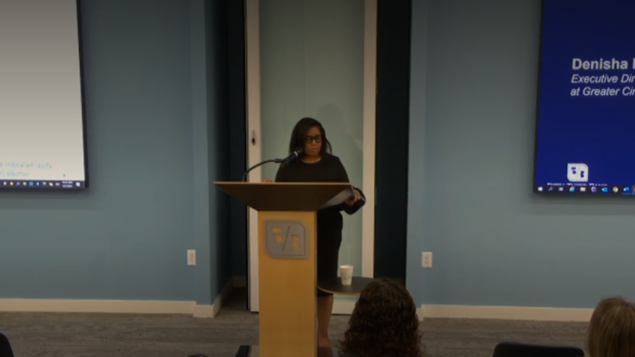 Denisha Porter standing at lectern